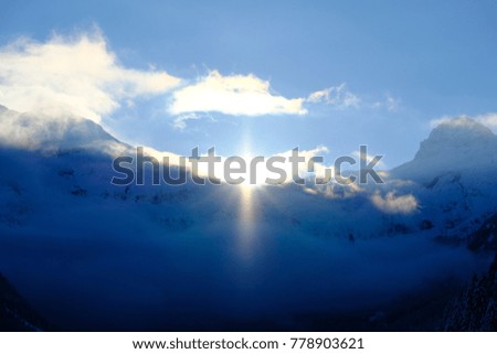 Sunrise over the swiss mountains in deep winter