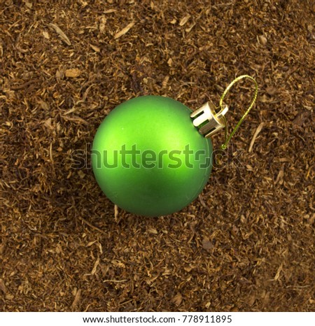 christmas bauble on a dry tobacco background,image of a