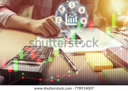 Double exposure of man use smartphone interface of Fintech and Calculator on the office desk with stock market or financial graph for financial investment concept.