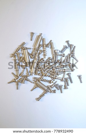 different metal clips on a white background