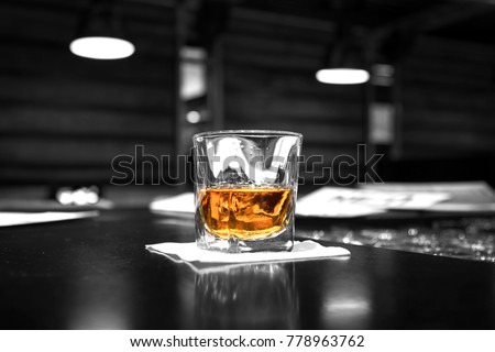 Black and white glass of whisky