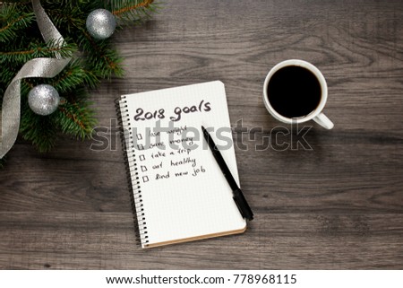 Notebook a cup of coffee and new year's goals