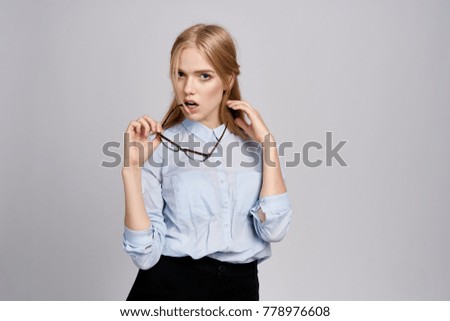   business woman with glasses on a light background                             