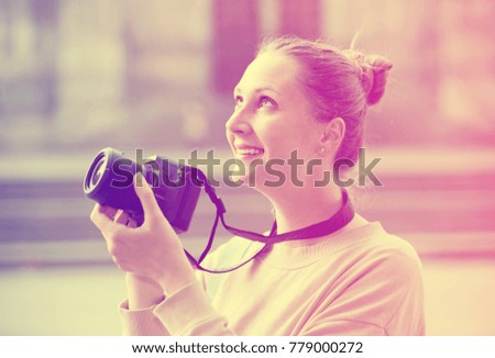 Portrait of girl taking photos while walking. 