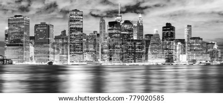 Black and white New York City skyline at night, USA.