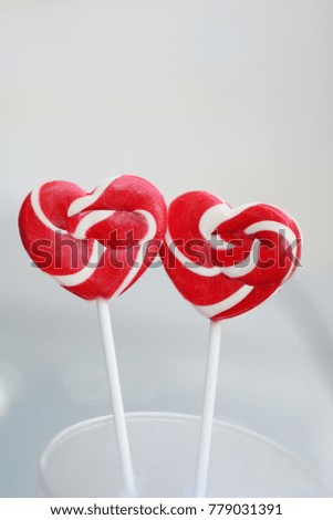 Two red heart candy for valentine concept love background