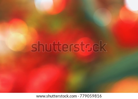 Bright red yellow orange green abstract beautiful colorful bokeh blurred lights texture background.