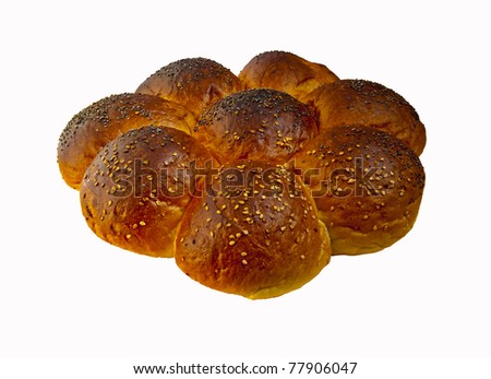 Buns sprinkled with grass seeds and baked in the form of chamomile.