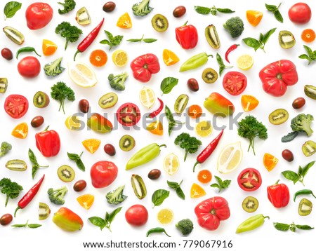 The concept of healthy eating. Pattern composition from vegetables and fruits, top view. Food background, wallpaper. Tomatoes, pepper, lemon, kiwi, basil, parsley isolated on white background. Royalty-Free Stock Photo #779067916