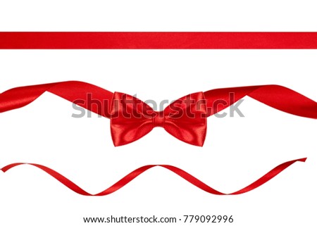 Christmas decoration of red ribbon bow with ribbons isolated on white background.