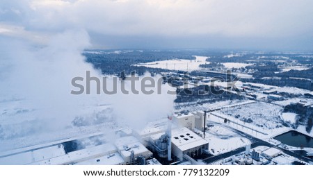 aerial view of a factory under the snow