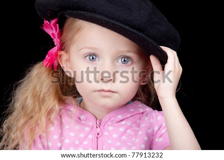 An amazing image of an adorable girl wearing a hat.
