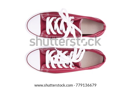 Red sneakers top view close up isolated on white background Royalty-Free Stock Photo #779136679