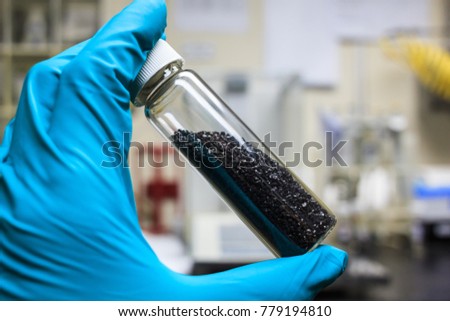 activated carbon or granular in clear bottle is used in air purification, decaffeinate, gold purification, metal extraction, water purification, medicine, sewage treatment, air filters in gas masks Royalty-Free Stock Photo #779194810