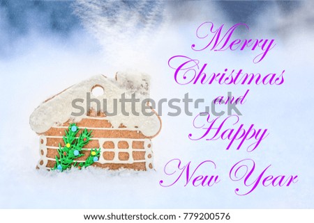 Gingerbread house on winter outdoor background. Greeting card, snow and smoke effect. inscription of Merry Christmas and happy New Year