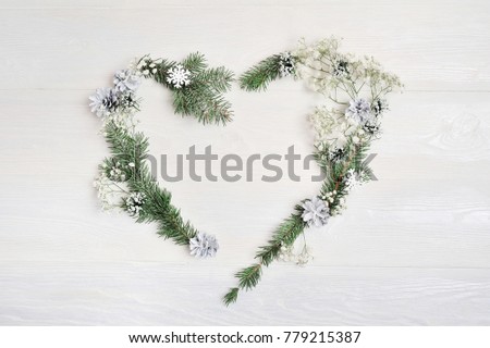 Mockup Christmas heart wreath with spruce, hypsophila, cones and snowflakes in rustic style with place for your text, Flat lay, top view photo mock up.