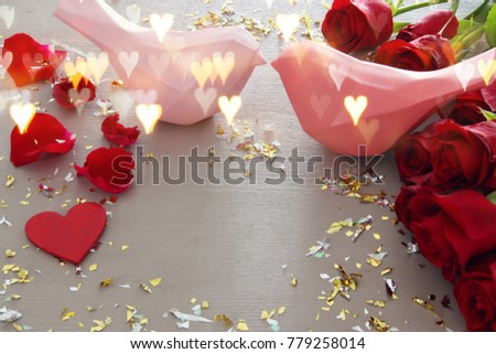 Valentine's day romantic background with beautiful bouquet of roses on wooden table