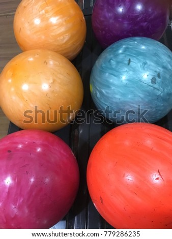Bowling ball are line up ready to be play anytime