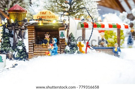 Miniature Christmas village scene. Christmas decorations toys.