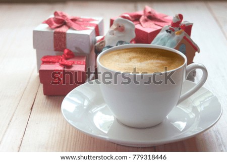  Coffee cup with gift for christmas.                              