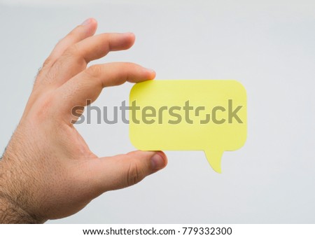 male hand hold Empty comics book balloon. Bubble square cloud icon speech phrase. Cartoon advertising label tag expression. Blank comic texts . isolated on white background. 