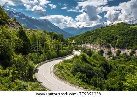 View on an empty asphalt road in the mountains covered with green trees in Svaneti region, Georgia
