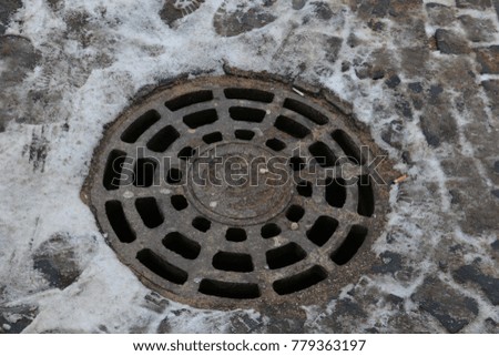 sewer in the sidewalk