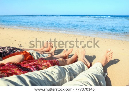 Beautiful traces with feet on sea nature background