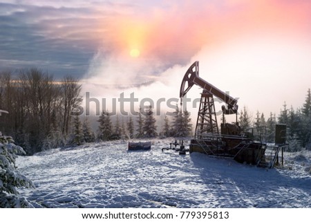 Day and night, in a severe frost and a snowstorm, a snowstorm in winter in Ukraine electric mountain pumps oil pump oil gas is a valuable raw material for energy 
 chemical industry
