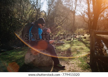 man with smartphone in nature