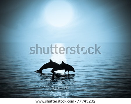 Two dolphins floating at ocean in moonlight