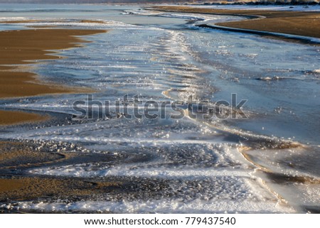 A sharp zigzag of the ice in the sand of the seashore, Latvia
