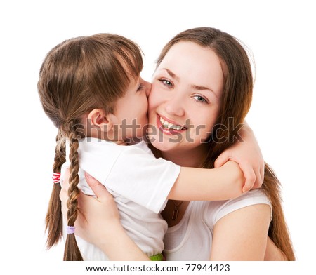 beautiful young mother and her five year old daughter embracing and kissing
