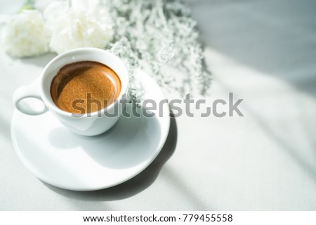 Cup of coffee on table in morning, couple in love concept