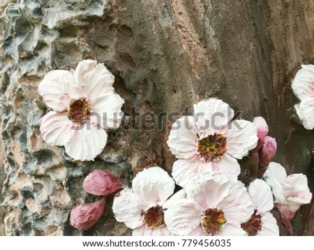 Low relief cement Thai style handcraft of flowers