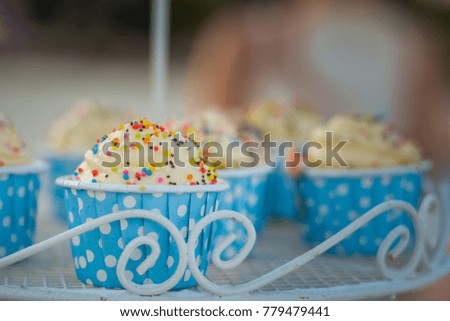 Tasty cupcakes in the blue cup 