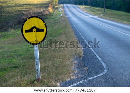 Speed bump traffic sign on blue sky background with clipping path included
