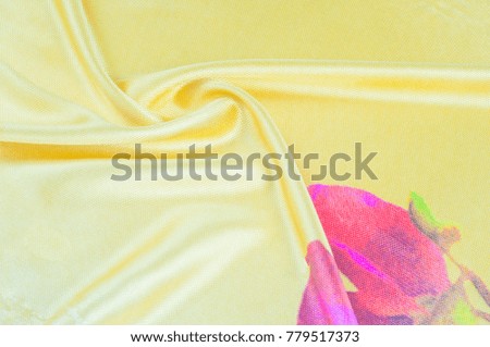 Background texture, pattern. silk fabric of yellow color with a floral pattern. Rinse down the memory strip with this nostalgic, multicolored floral pattern with digital printing.
