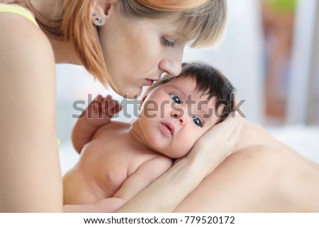 Portrait of mother and newborn child baby