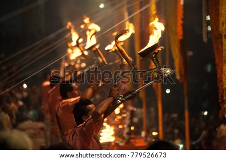 Hindu priests perform an Arti worship ceremony at  Ganges River, Varanasi, Uttar Pradesh, India Royalty-Free Stock Photo #779526673