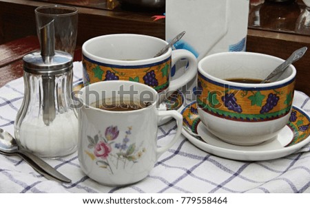 cup and saucer sitting on the table with coffee in a hotel restaurant area stock photo 