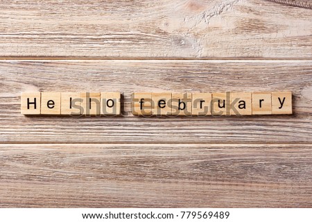 Hello February word written on wood block. Hello February text on table, concept.