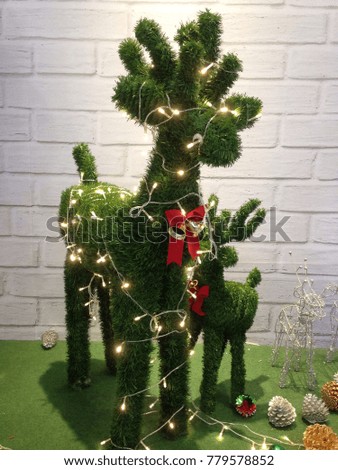 cute reindeer with decorated antlers for Christmas
