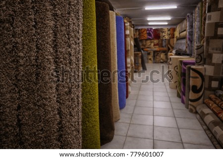 Assortment of different carpets in store
