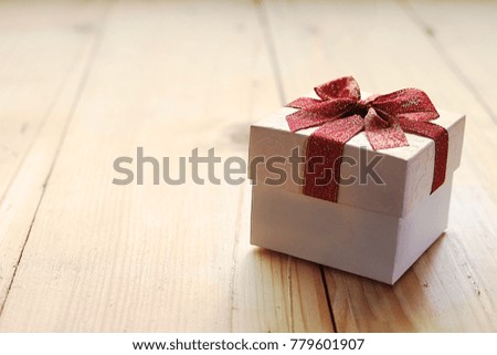 Gift on wood plate, christmas concept,have space for idea.