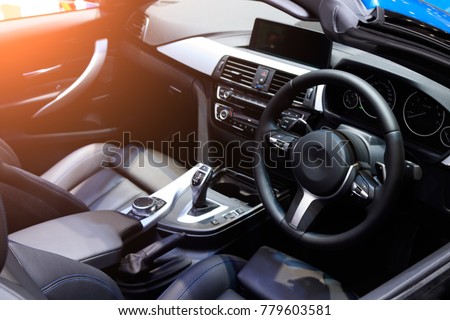 car interior. Modern car speedometer and illuminated dashboard. Luxurious car instrument cluster. Close up shot of hybrid car instrument panel Royalty-Free Stock Photo #779603581