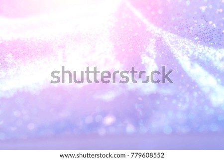 Abstract xmas violet or pink glitter lights. Christmas festive  background. Defocused bokeh  particles. Template for design