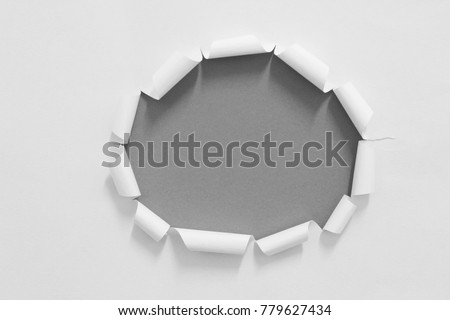 pieces of hole paper on black. copy space