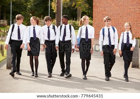 Group Of Teenage Students In Uniform Outside School Buildings Royalty-Free Stock Photo #779645431