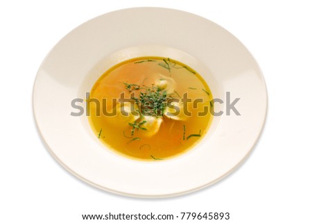 Ready-made lunch, delicious soup sprinkled with herbs, serving in a large white dish